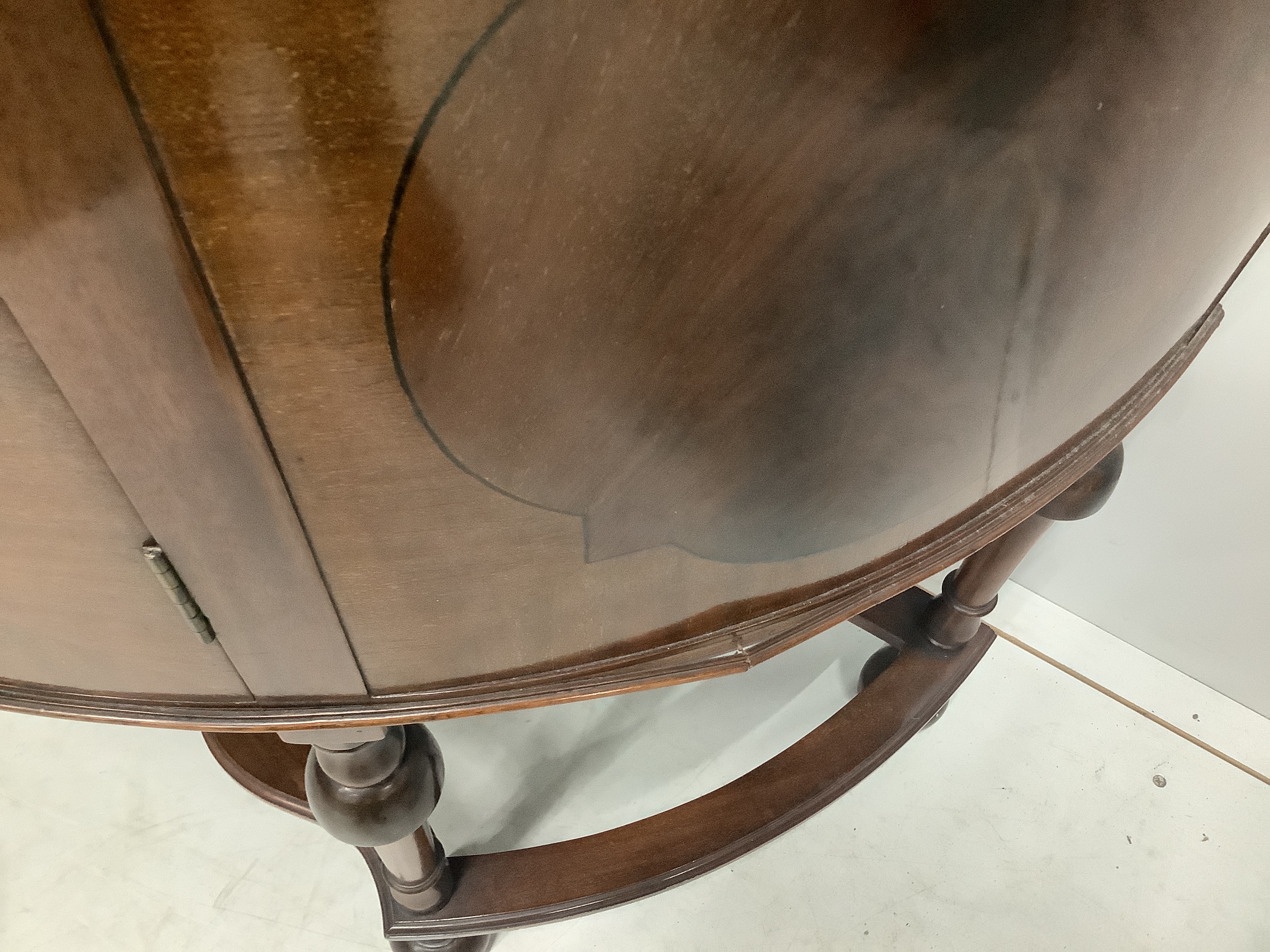 An Edwardian mahogany bow fronted glazed china display cabinet, with cupboard under, width 97cm, depth 44cm, height 181cm